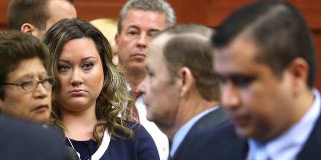 July 12, 2013: George Zimmerman's wife, Shellie, watches her husband leave the courtroom during a recess in his trial at the Seminole circuit court in Sanford, Florida.