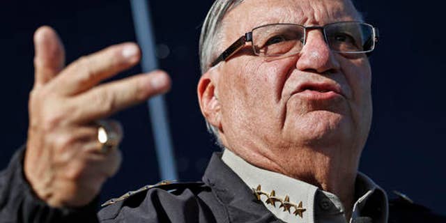 FILE - In this Jan. 9, 2013, file photo, Maricopa County Sheriff Joe Arpaio speaks to reporters in Phoenix, Ariz. Arpaio's lawyers want a federal judge to recuse himself from all future proceedings in a racial-profiling case. Attorney Charles Cooper says U.S. District Judge Murray Snow "has engaged in improper private, off-the-record meetings and communications about the merits of the case with the court-appointed monitor" investigating the sheriff's office. The motion filed Wednesday, Oct. 26, 2016, also seeks removal of the monitor. (AP Photo/Ross D. Franklin, File)