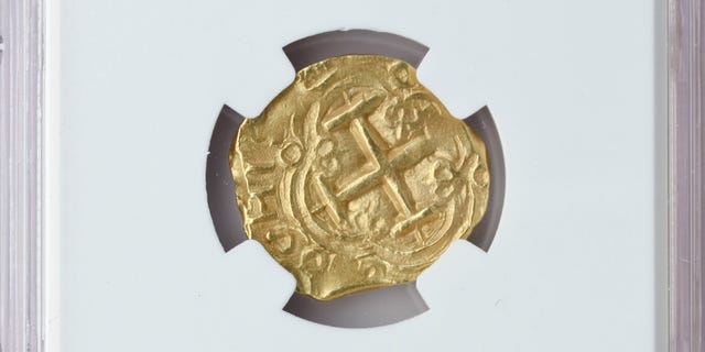 In this Oct. 19, 2016, handout photo photo released by Blanchard and Company, a gold coin from a 300-year-old shipwreck discovered off Florida's coast is displayed in New Orleans. Blanchard and Company is one of two dealers offering the coins from an area where 11 treasure-laden ships of a Spanish fleet were smashed onto reefs by a hurricane on July 31, 1715. The other dealer is California-based Monaco Rare Coins. (Blanchard and Company via AP)