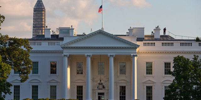 A flag flies at half-staff above the White House after President Barack Obama made the proclamation to honor the victims of the shootings at the Washington Navy Yard on Monday, Sept. 16, 2013, in Washington. At least one gunman launched an attack inside the Washington Navy Yard, spraying gunfire on office workers in the cafeteria and in the hallways at the heavily secured military installation in the heart of the nation's capital, authorities said. (AP Photo/ Evan Vucci)