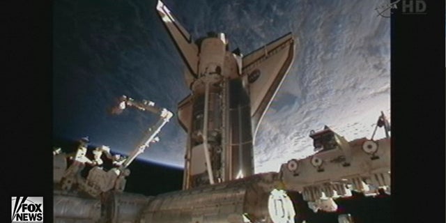 Space shuttle Discovery docked with the International Space Station at 2:14 p.m. EST Saturday.