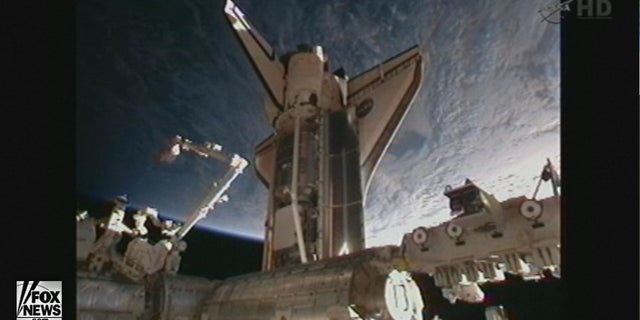Space shuttle Discovery docked with the International Space Station at 2:14 p.m. EST Saturday.