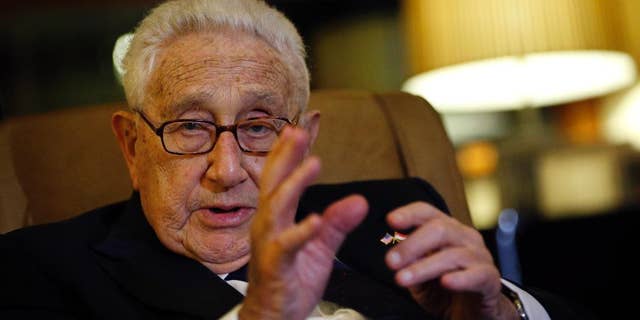 Former U.S. Secretary of State Henry Kissinger speaks to reporters Saturday, March 28, 2015, in Singapore. (Associated Press)