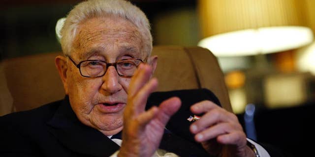 Former U.S. Secretary of State Henry Kissinger speaks to reporters Saturday, March 28, 2015, in Singapore. (Associated Press)