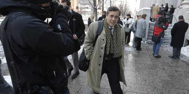 FILE - In this Jan. 17, 2013, file photo, Jonathan Turley, attorney for Kody Brown and his four wives, the stars of the reality show "Sister Wives," leaves the Frank E. Moss United States Courthouse after a hearing on whether Utah can prohibit plural marriage, in Salt Lake City. A federal judge in Utah has issued a final ruling that strikes down parts of the state's anti-polygamy law, in a lawsuit filed by a family that appears on the TV show "Sister Wives." The Brown family was overwhelmed and thankful for the ruling, said their attorney, Turley. (AP Photo/Rick Bowmer, File)