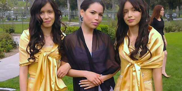 This 2013 photo provided by Miguel Serrato shows twin sisters Marisol Serrato, 17, left, and Marisa Serrato, right, with their sister-in-law Ivette Serrato during a wedding in Riverside, Caif. The twins were part of the group more than 40 high school students whose trip to visit a college turned tragic when a FedEx tractor-trailer veered across a grassy highway median and slammed into their bus in a wreck that left 10 people dead, authorities said. Marisa was one of the twins on the bus that crashed but is still unaccounted for. Marisol was on another bus that wasn't in the accident. (AP Photo/Courtesy Miguel Serrato)