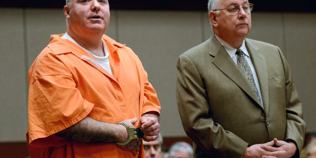 January 24: Michael Skakel, left, addresses the court with attorney his Hubert Santos in Middletown, Connecticut. Skakel is seeking a reduction in his sentence of 20 years to life in prison for killing his neighbor Martha Moxley.