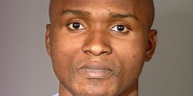 Feb. 2000: Charly Keundeu Keunang after his arrest for robbery.