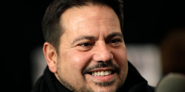 FILE - This Feb. 15, 2011 file photo shows designer Narciso Rodriguez backstage before the presentation of his Fall 2011 show at Lincoln Center during Fashion Week in New York. Rodriguez will receive a National Design Award this year from the Smithsonians Cooper-Hewitt National Design Museum, along with 10 other top names in design. Rodriguez designed the black and red dress worn by first lady Michelle Obama in Chicago on election night in 2008. The dress recently went on display at the National Archives to represent her signature style. Earlier, Rodriguez designed Carolyn Bessettes wedding dress for her 1996 marriage to John F. Kennedy Jr. (AP Photo/Kathy Willens, File)
