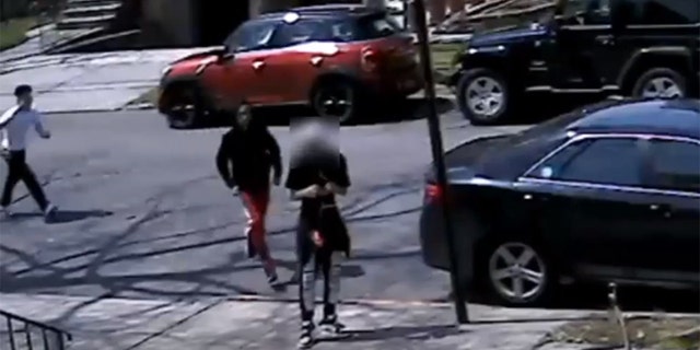 Police are investigating a mugging caught on video in which a 17-year-old was robbed of his sneakers in Queens, N.Y., on April 28.