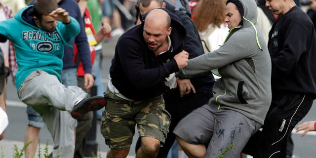 June 12, 2012: Fans clash prior to the Euro 2012 soccer championship Group A match between Poland and Russia in Warsaw, Poland.