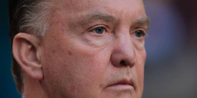 Netherlands' coach Louis van Gaal watches his players during the line up prior to the international friendly soccer match between Netherlands and Ecuador at ArenA stadium in Amsterdam, Netherlands, Saturday, May 17, 2014. (AP Photo/Peter Dejong)