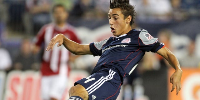 FILE - In this Aug. 6, 2011 file photo, New England Revolution midfielder Diego Fagundez scores a goal against Chivas USA during the second half of an MLS soccer match, in Foxborough, Mass. (AP Photo/Stew Milne, File)