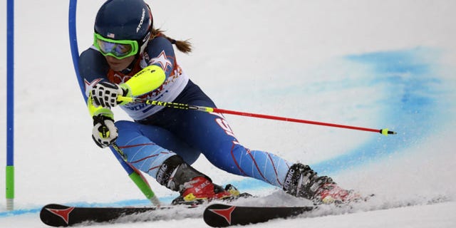 February 18, 2014: United States' Mikaela Shiffrin passes a gate in the first run of the women's giant slalom at the Sochi 2014 Winter Olympics in Krasnaya Polyana, Russia. (AP Photo/Charles Krupa)