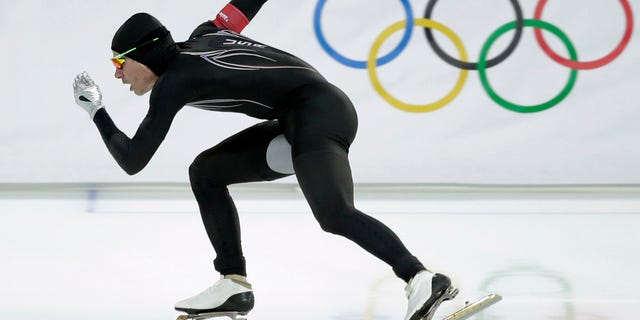 In this Monday, Feb. 10, 2014 file photo, Tucker Fredricks of the United States competes in the first heat of the men's 500-meter speedskating race at Adler Arena in Sochi, Russia, during the 2014 Winter Olympics. After a strong season on the World Cup circuit, the U.S. speedskating team has had a miserable performance the first week of the Sochi Olympics â and much of the speculation has turned to its new high-tech Under Armour skinsuit developed with help from aerospace and defense giant Lockheed Martin. (AP)