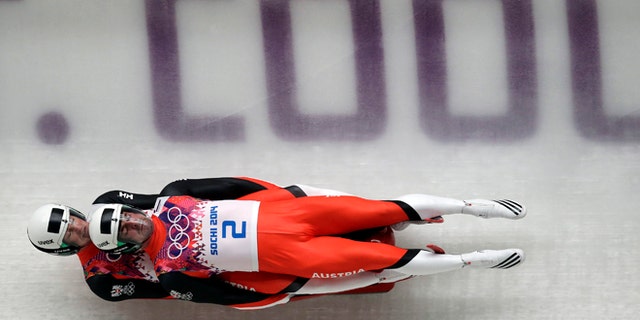 Feb. 12, 2014: The doubles team of Andreas Linger and Wolfgang Linger of Austria speed down the track in their final run during the men's doubles luge at the 2014 Winter Olympics.