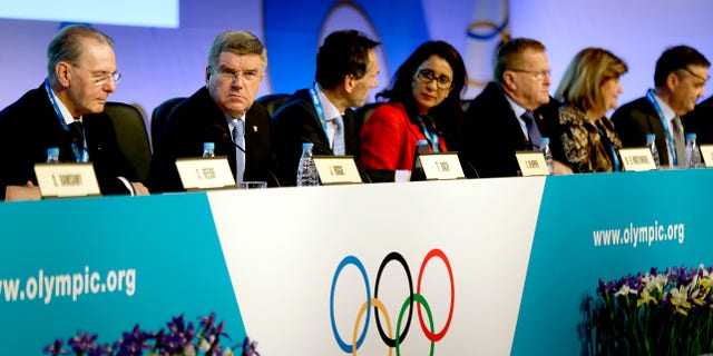 Feb. 5, 2014: International Olympic Committee President Thomas Bach, second from left, opens the IOC's general assembly at the 2014 Winter Olympics in Sochi, Russia.