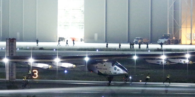 The Solar Impulse 2, a solar powered plane, touches down at Nagoya airport in Japan June 1, 2015.