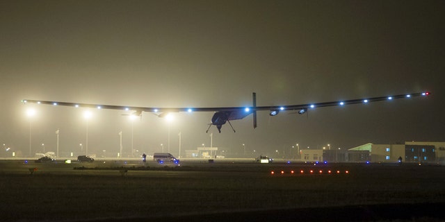 The Solar Impulse 2 plane is seen landing at Nanjing Lukou International Airport, Jiangsu province April 21, 2015.