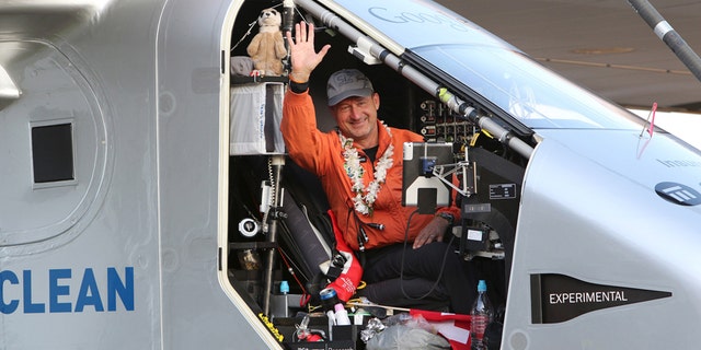 File photo - Pilot Andre Borschberg waves to the crowd after he landed Solar Impulse 2 at Kalaeloa airport, Hawaii, July 3, 2015.