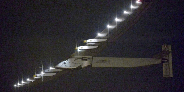 The Solar Impulse 2 flies over Nagoya Airport after taking off in Toyoyama, near Nagoya, central Japan.