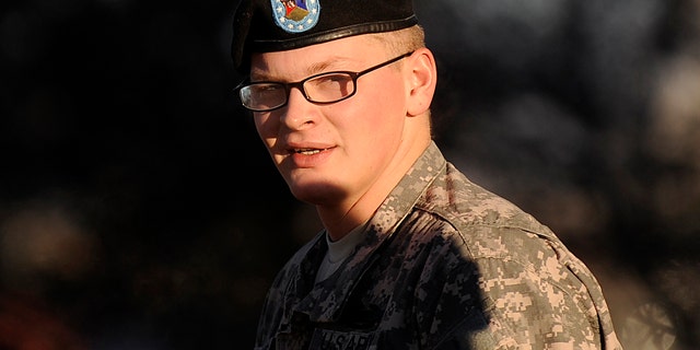 Nov. 30: Pfc. David Lawrence takes a break from an Article 32 hearing at Fort Carson, Colo. Lawrence is charged with fatally shooting a jailed Taliban leader he was supposed to be guarding in Afghanistan. His lawyer portrays him as a young man afflicted with schizophrenia and depression and given scant medical care after asking the Army for help.