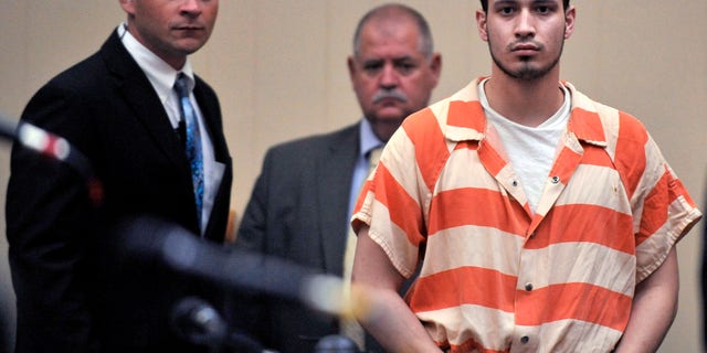 Aug. 30, 2012: In this file photo, Pvt. Isaac Aguigui walks into the courtroom during a preliminary hearing at Long County Superior Court in Ludowici, Ga.