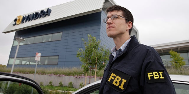 Sept. 8, 2011: FBI agents stand guard outside of Solyndra headquarters in Fremont, Calif.