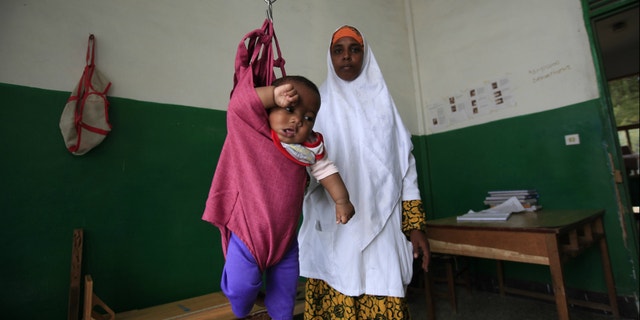 An internally displaced child is weighed at Banadir Hospital in Mogadishu, Somalia.
