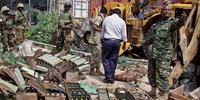 July 27, 2014: In this photo, African Union (AU) peacekeepers stand near a cache of weapons recovered from a garage in Mogadishu, Somalia. (AP)