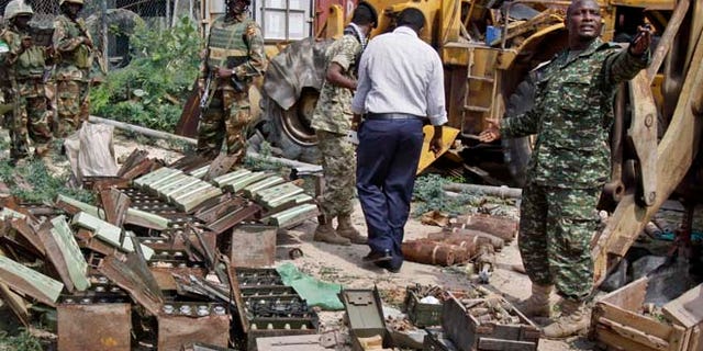 July 27, 2014: In this photo, African Union (AU) peacekeepers stand near a cache of weapons recovered from a garage in Mogadishu, Somalia. (AP)