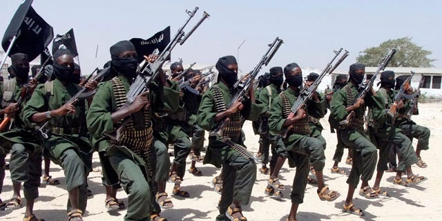 In this file photo, hundreds of newly trained al-Shabab fighters perform military exercises in the Lafofe area south of Mogadishu, in Somalia.