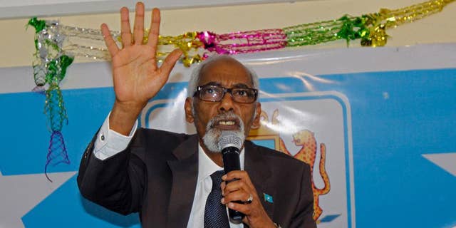 In this photo taken,Tuesday, Nov. 11, 2014,  Somalia's Speaker of Parliament Mohamed Sheikh Osman gestures, during a meeting at parliament hall in Mogadishu, Somalia. Somalia’s parliamentary speaker says he has decided to drop an impeachment motion against the president in favor of talks to end the political crisis. (AP Photo/Farah Abdi Warsameh)