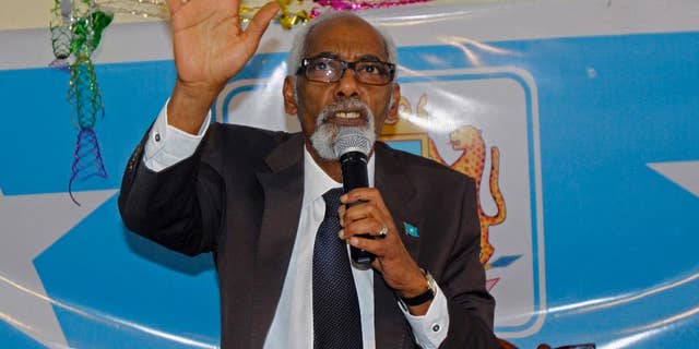 In this photo taken,Tuesday, Nov. 11, 2014, Somalia's Speaker of Parliament Mohamed Sheikh Osman gestures, during a meeting at parliament hall in Mogadishu, Somalia. Somalia’s parliamentary speaker says he has decided to drop an impeachment motion against the president in favor of talks to end the political crisis. (AP Photo/Farah Abdi Warsameh)