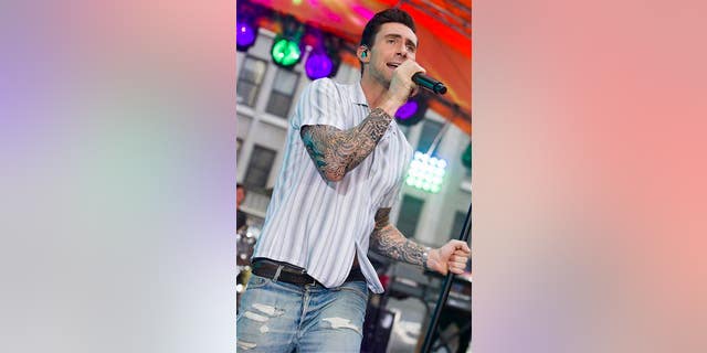 Adam Levine from Maroon 5 performs.