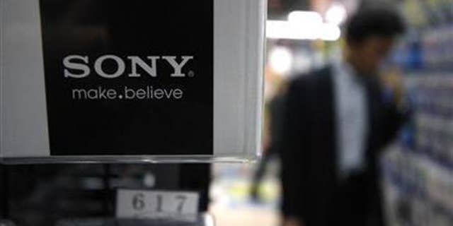A man looks at Sony Corp's products at an electronics store in Tokyo May 26, 2011.
