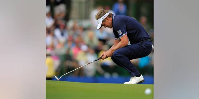 FILE - In this April 20, 2014, file photo, Luke Donald, of England, reacts after missing a birdie putt on the 17th green during the final round of the RBC Heritage golf tournament in Hilton Head Island, S.C. Some of the biggest stars in Europe are starting their year in Abu Dhabi on Thursday. Donald is in Honolulu. That's by design. This year is about getting back to his strengths, and getting back to his roots. Donald could pick off a few European Tour requirements, but he tends to play well during the West Coast Swing on the PGA Tour, and that's where he will start. And thus begins what he hopes will be the road back at the Sony Open. (AP Photo/Stephen B. Morton, File)