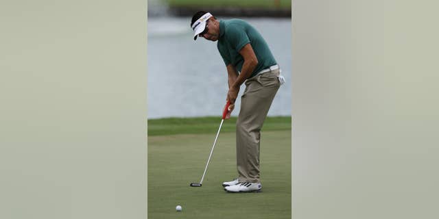 Robert Allenby of Australia putts on the third green during the second round of the Sony Open golf tournament, Friday, Jan. 16. 2015, in Honolulu. Allenby says he was robbed, beaten and dumped in a park Saturday Jan. 17, 2015 after missing the cut in the Sony Open, leaving him with cuts and a deep scrape on his forehead. (AP Photo/Hugh Gentry)