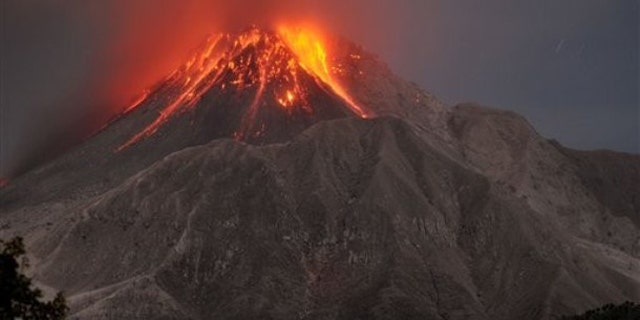 The Soufriere Hills volcano erupts in the Caribbean island of Montserrat, Saturday, Jan. 23, 2010.