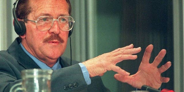 FILE - In this Tuesday Aug. 19, 1997 file photo, former Conservative Party politician Clive Derby-Lewis, makes a statement at an amnesty hearing in Pretoria, South Africa. On Friday, May 29, 2015 a judge granted parole to Derby-Lewis who was convicted for the 1993 assassination of Chris Hani, leader of the South African Communist Party and head of the African National Congress' military wing during apartheid, for which he received a life sentence. (AP Photo/Joao Silva-File)