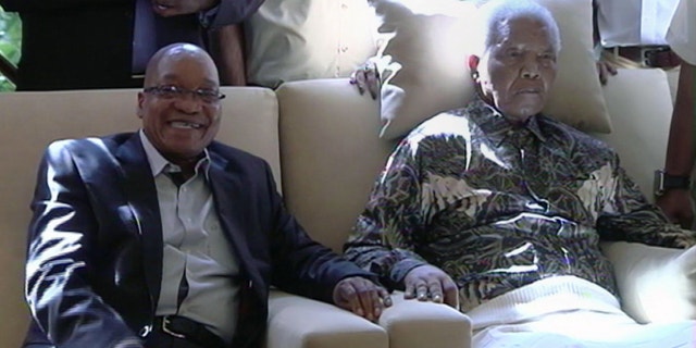 April 29, 2013 - In this image taken from video, South African President Jacob Zuma, left, sits with the ailing anti-apartheid icon Nelson Mandela.