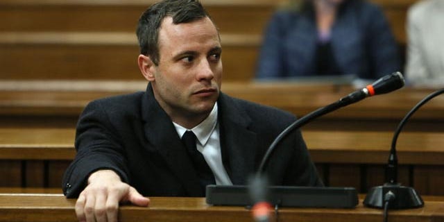 July 8, 2014: Oscar Pistorius attends court at his murder trial for the shooting death of his girlfriend Reeva Steenkamp on St. Valentine's Day 2013 in Pretoria, South Africa. (AP Photo/Alon Skuy, Pool)