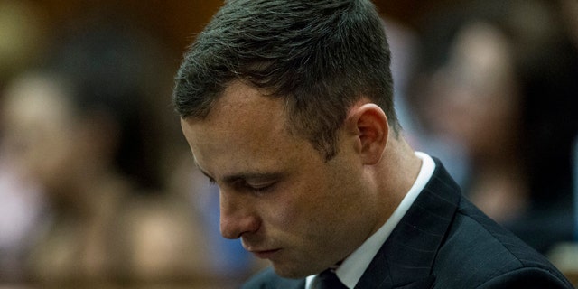 October 13, 2014: Oscar Pistorius arrives in court to face sentencing for the shooting death of his girlfriend Reeva Steenkamp. (AP Photo/Marco Longari. Pool)