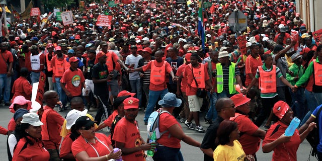 Mar. 7, 2012: South African protestors march downtown Johannesburg, South Africa.