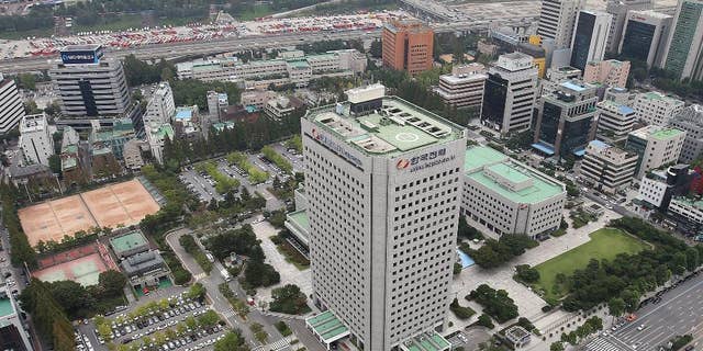 This Sept. 17, 2014 photo, shows Korea Electric Power Corp's headquarters, center, in Seoul, South Korea. The consortium led by Hyundai Motor Co. offered 10.55 trillion won ($10.1 billion) for land in Seoul's tony Gangnam district where it will build a new headquarters, on Thursday, Sept. 18, 2014. (AP Photo/Yonhap, Han Jong-chan) KOREA OUT