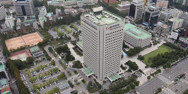 This Sept. 17, 2014 photo, shows Korea Electric Power Corp's headquarters, center, in Seoul, South Korea. The consortium led by Hyundai Motor Co. offered 10.55 trillion won ($10.1 billion) for land in Seoul's tony Gangnam district where it will build a new headquarters, on Thursday, Sept. 18, 2014. (AP Photo/Yonhap, Han Jong-chan) KOREA OUT