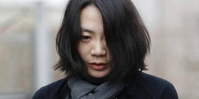 FILE - In this Dec. 12, 2014 file photo, Cho Hyun-ah, who was head of cabin service at Korean Air and the oldest child of Korean Air chairman Cho Yang-ho, speaks to the media upon her arrival for questioning at the Aviation and Railway Accident Investigation Board office of Ministry of Land, Infrastructure and Transport in Seoul, South Korea. The former Korean Air executive famous for an inflight tantrum over macadamia nuts pleaded not guilty Monday, Jan. 19, 2015 to violating aviation safety law and three other charges. (AP Photo/Lee Jin-man, File)