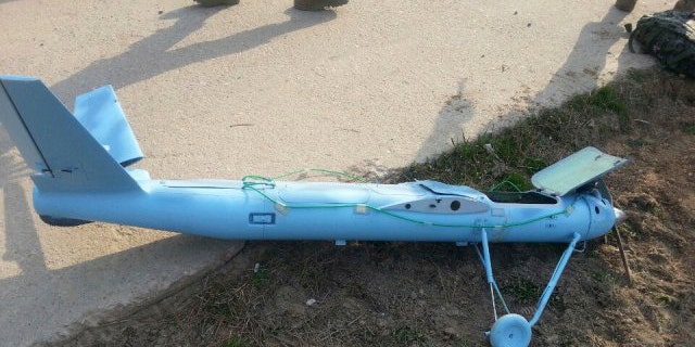 March 31, 2014: In this photo released by the South Korea Defense Ministry, an unmanned drone lies on the ground damaged on Baengnyeong Island, South Korea, near the West Sea border with North Korea when the two Koreas fired hundreds of artillery shells into each other's waters. South Korea suspects that the drone that crashed on the frontline South Korean island was flown by rival North Korea, an official said Wednesday. (AP Photo/South Korea Defense Ministry)