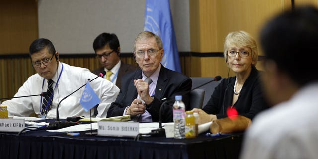 August 21, 2013: Michael Donald Kirby, center, the chairman of the U.N. commission of Inquiry on human rights in North Korea, listens to Ahn Myung-chul, right, who worked as a guard and driver at several political prisoner camps in the 1990s before defecting to south, during the U.N. hearing in Seoul, South Korea.
