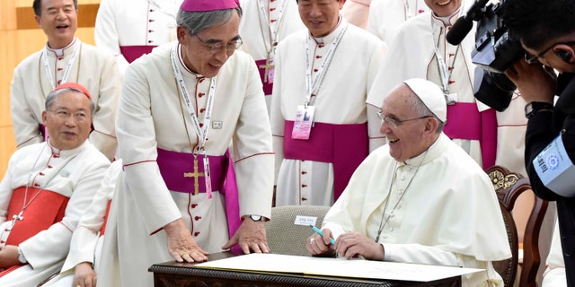 Aug. 14, 2014 - Pope Francis, right, meeting with the bishops of Korea at the headquarters of the Korean Episcopal Conference in Seoul, South Korea.